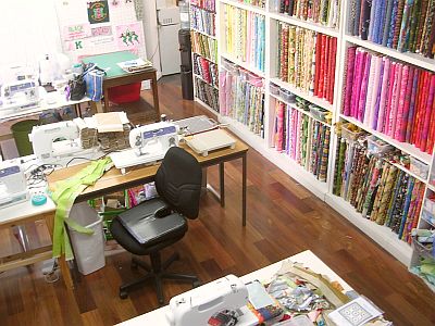 Shelves of bright fabric at San Francisco Sewing & Quilting Collaborative