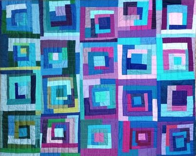 art quilt by Joy-Lily, 'Granny Squares for Quilters'. Log cabins in jewel tones.